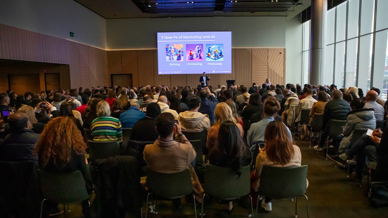Justin Kabbani delivering an AI keynote to a full auditorium at the AI Marketing Summit in Melbourne